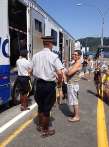 Molly chatting up one of the Royal Canadian Mounties while waiting for the ferry.